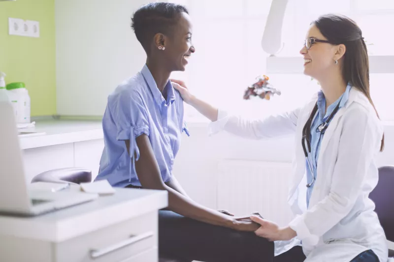A woman at her annual check up with her trusted doctor