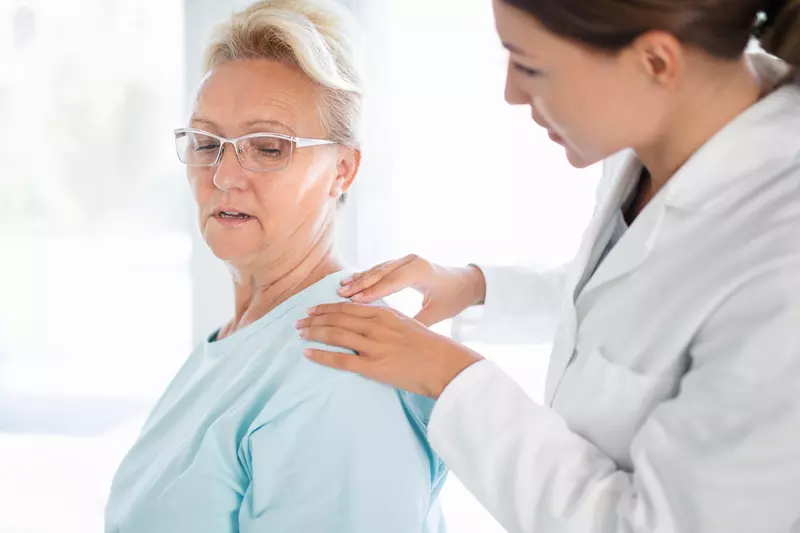 Woman Discussing Her Pain with Doctor