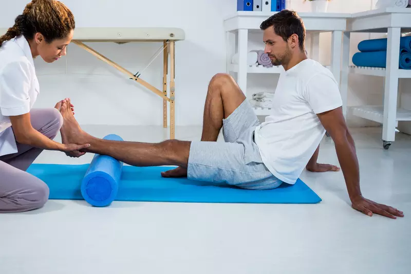 Man having physical therapy on his foot