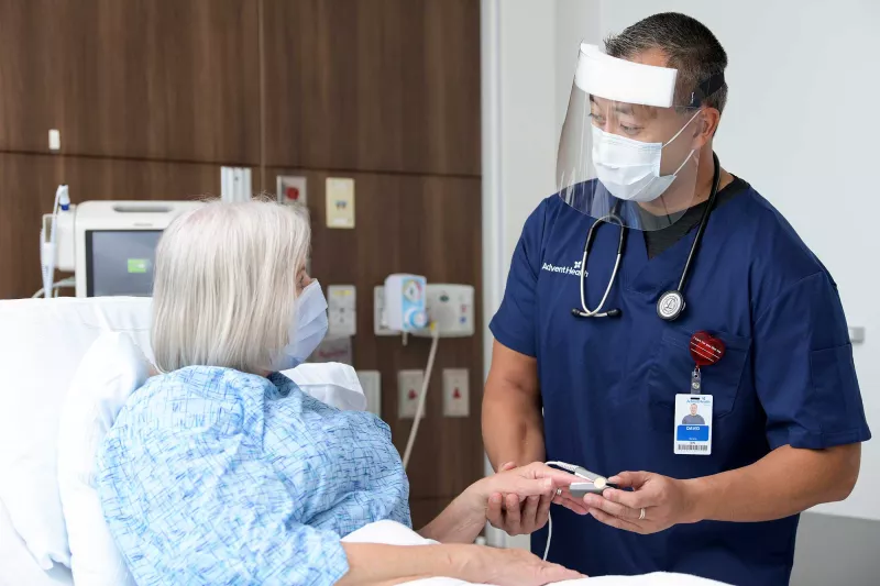 A nurse doing a medical test on a patient