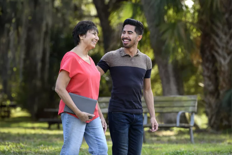 A man and woman walking outdoors in Florida