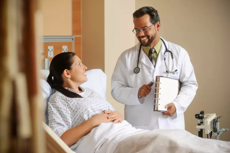 Doctor in room with patient