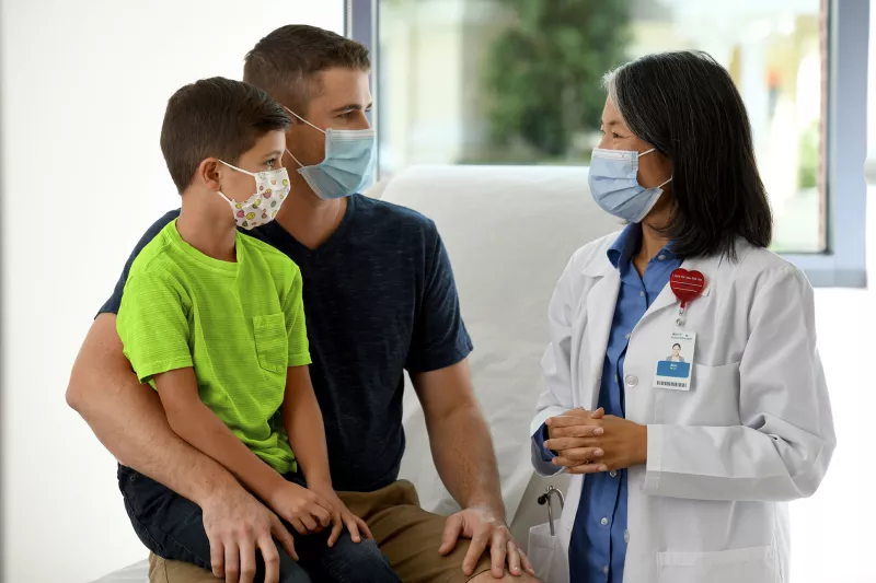 A father talking to a pediatric doctor