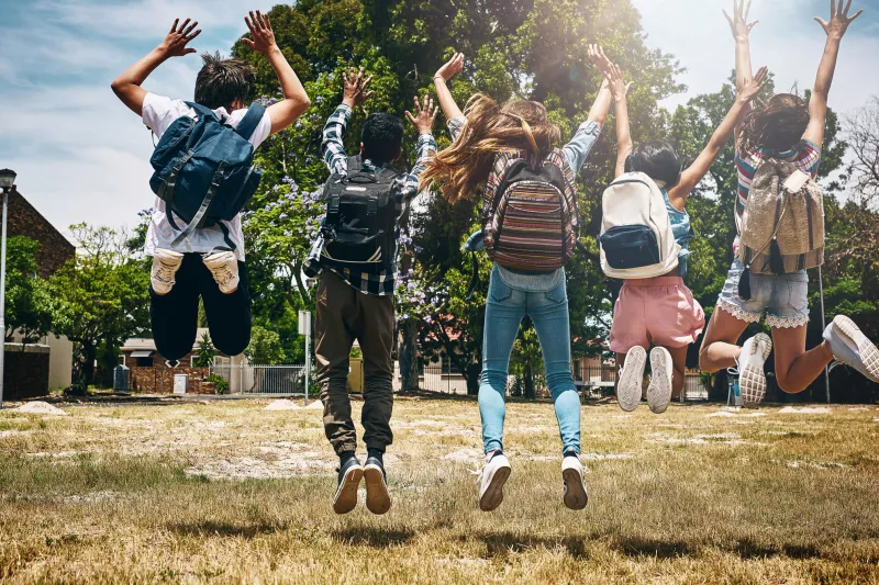 Children wearing backpacks.