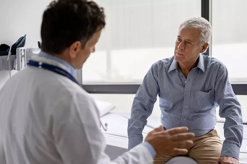 A Doctor Speaks to His Senior Patient About His Treatment Plan in an Exam Room