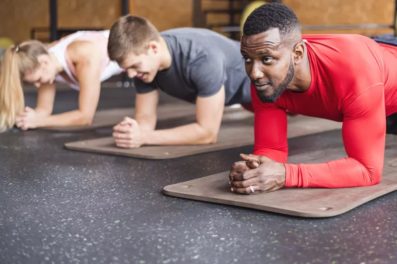 A group exercise class builds core strength.