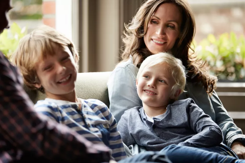 A family spends time together on the couch.