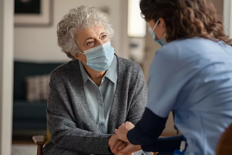 A woman with a caregiver.