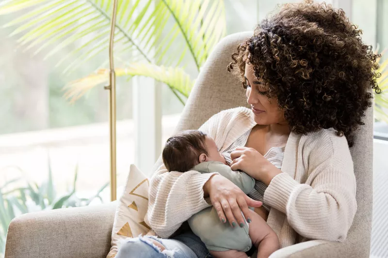 A new mom breastfeeding her infant.