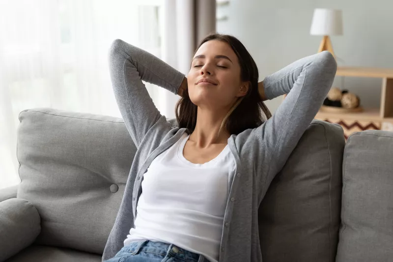 An adult woman rests at home