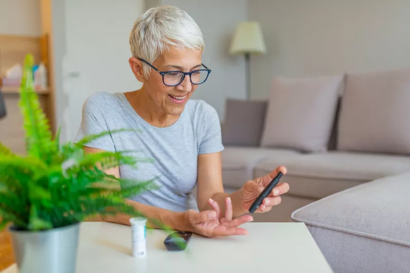 Woman checking blood sugar.