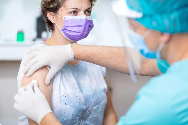 A woman getting her annual flu shot.