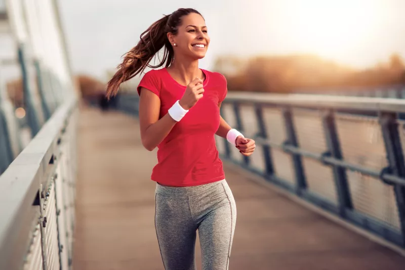 A woman running outdoors.