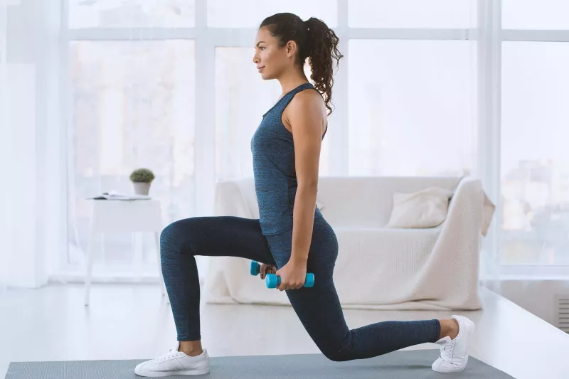 A woman exercising at home.