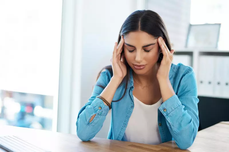 Woman having a migraine 