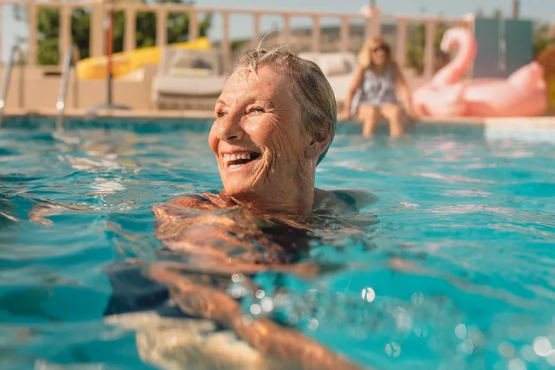 Mature woman swimming in pool