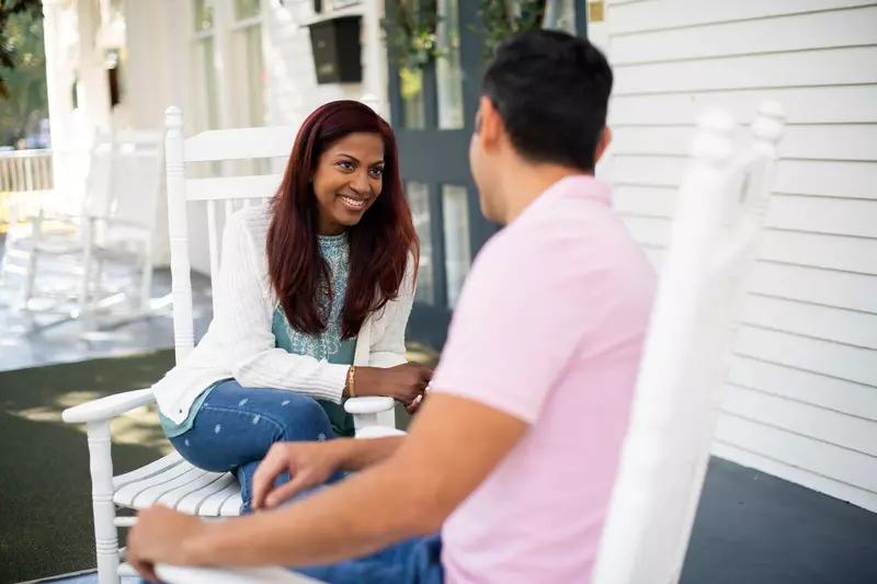 Smiling couple sitting outdoors