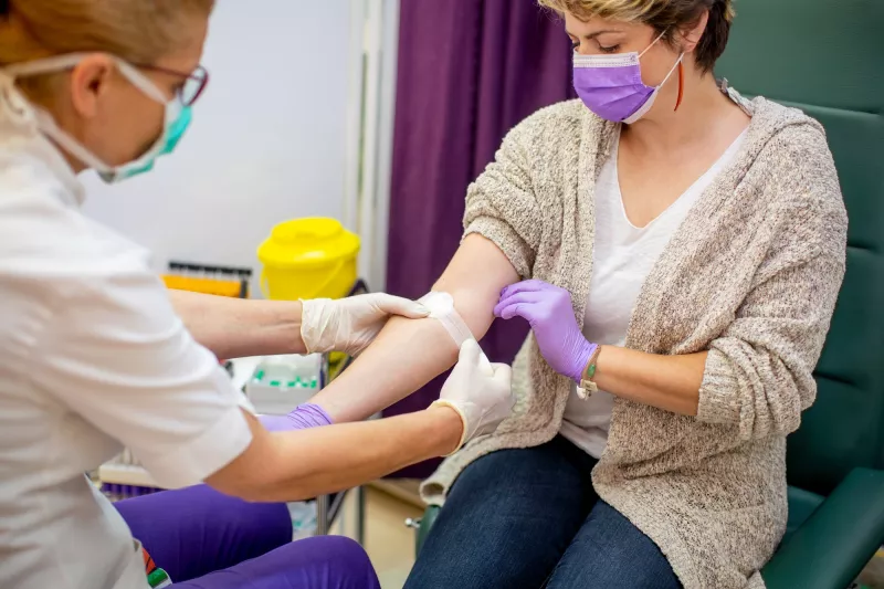 A woman donating blood.