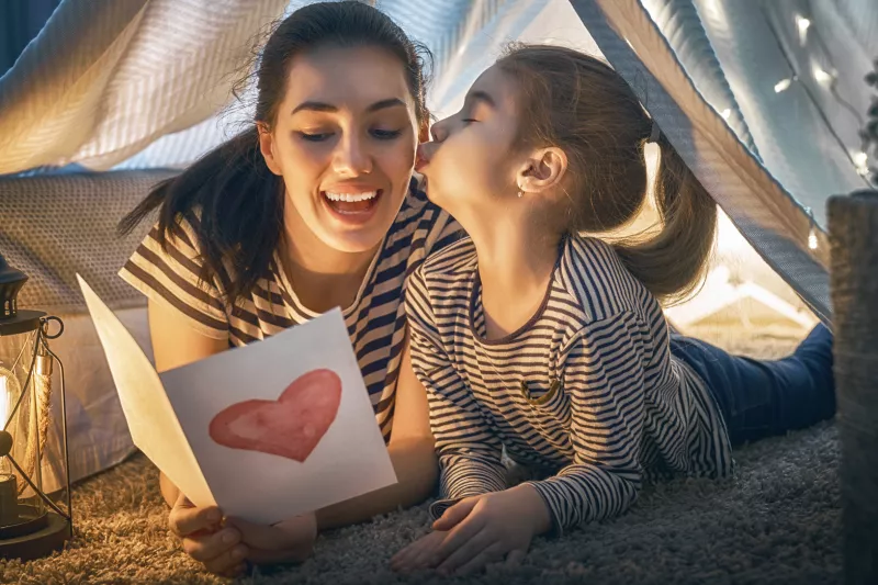 Mother and daughter laughing