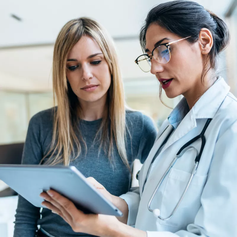 A Provider Goes Over a Patient's Chart with Her.