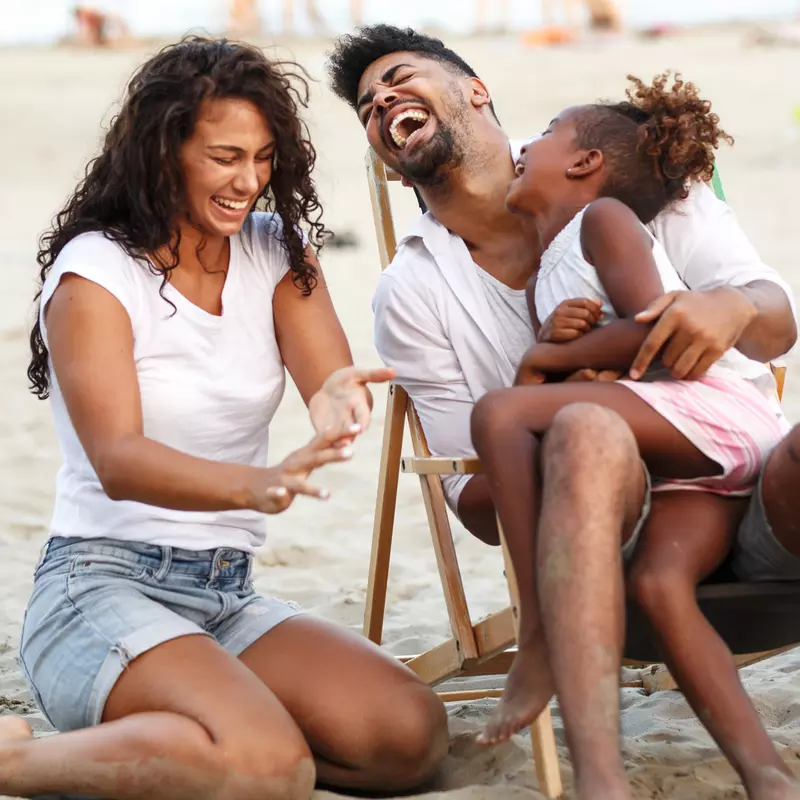Family enjoying the beach in summertime.