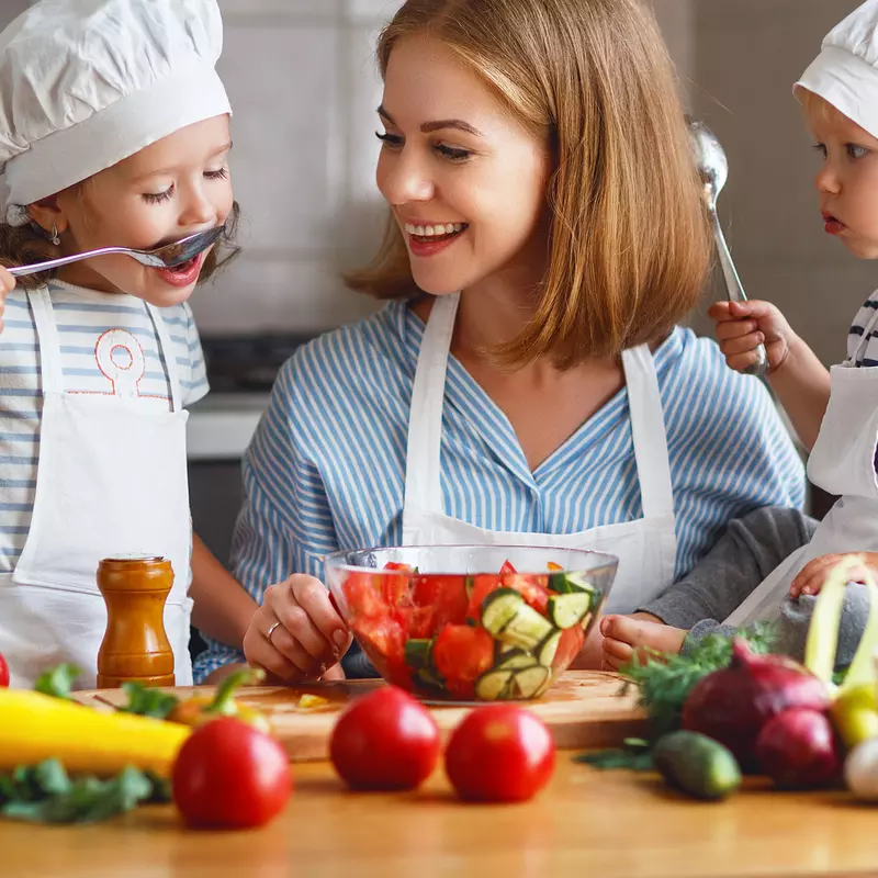 A mom teaches her little ones good nutrition habits.