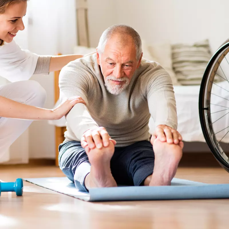 Man doing physical therapy at home