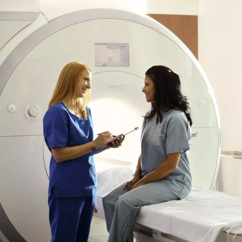 Woman Patient Getting MRI Talking to Nurse