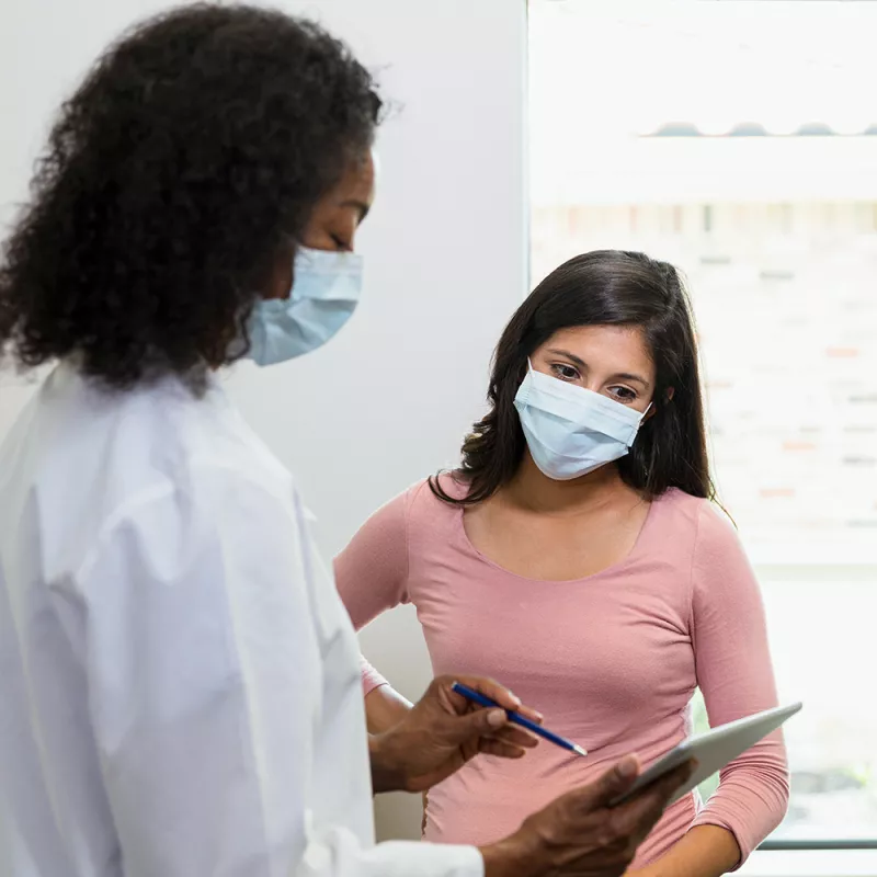 Doctor Talking to a patient about mammogram results.