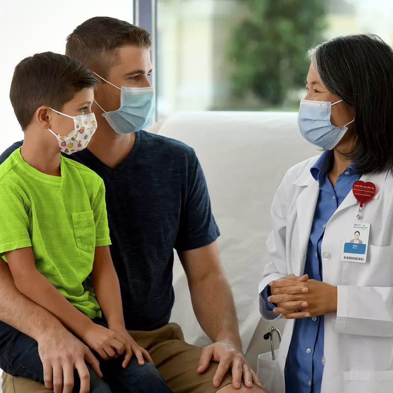A father talking to a pediatric doctor