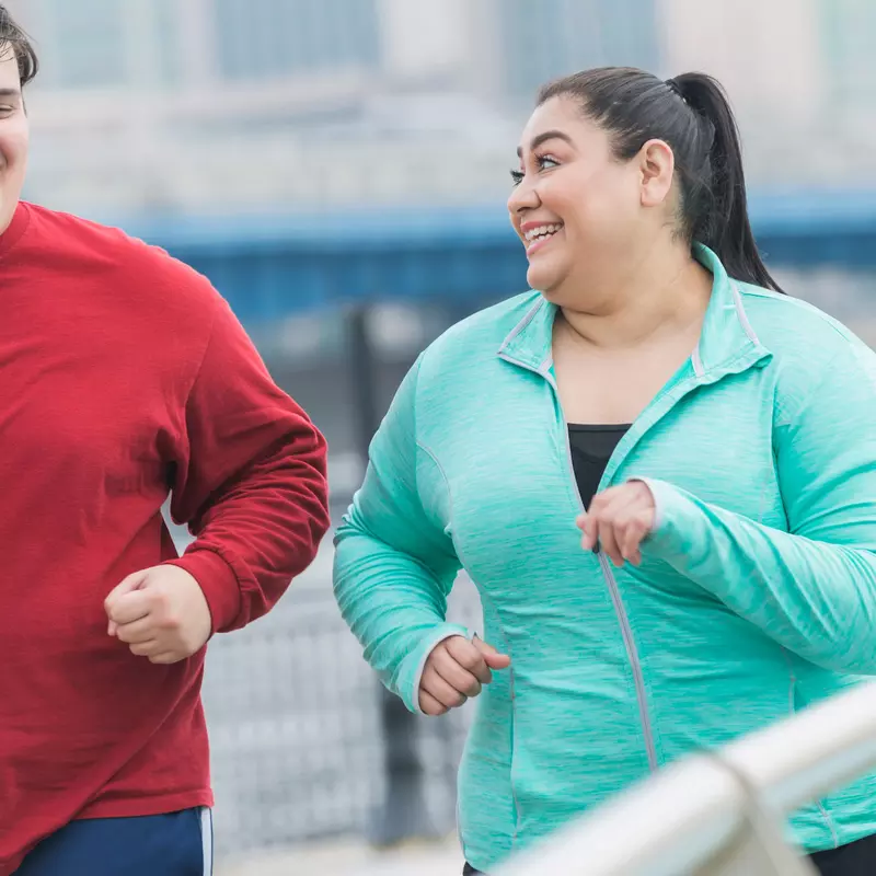 A couple goes for a jog together to improve their health.