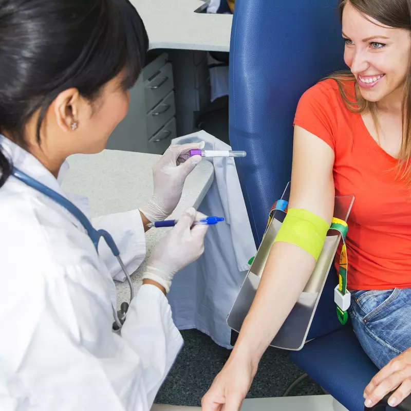 Woman preparing to have her blood drawn