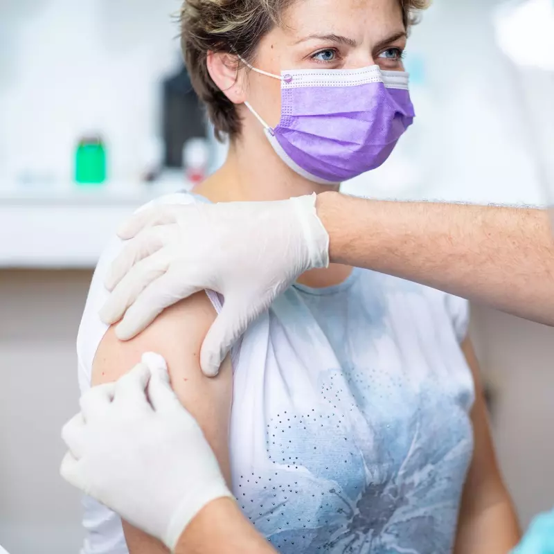 A woman getting her annual flu shot. 
