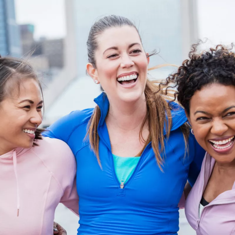 Three smiling female friends