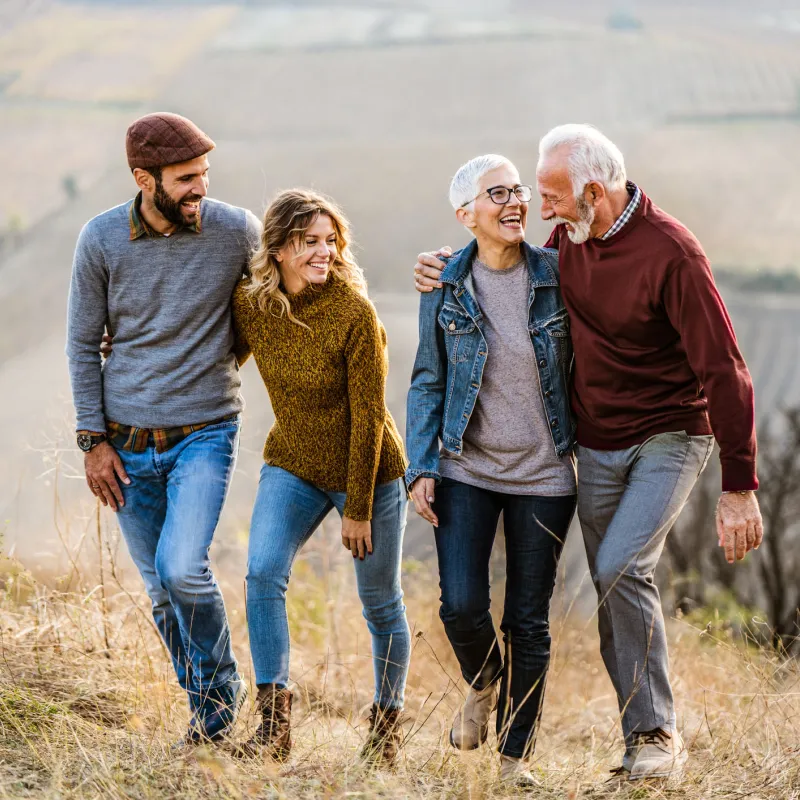 Younger couple walking with older couple