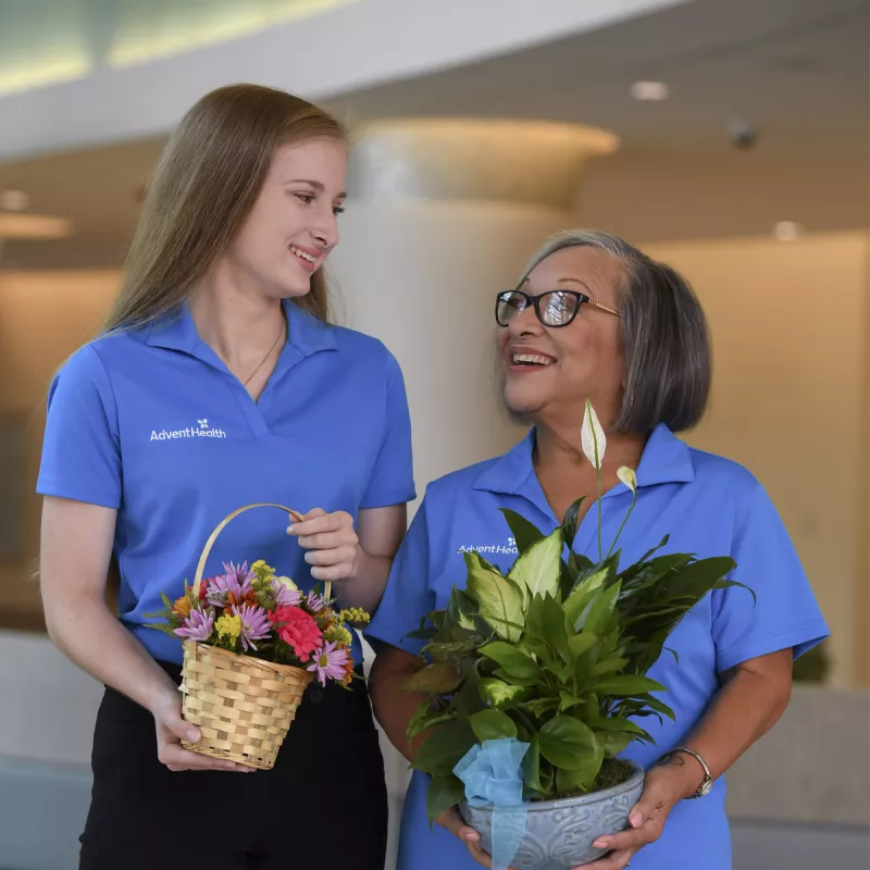 Volunteers holding gifts
