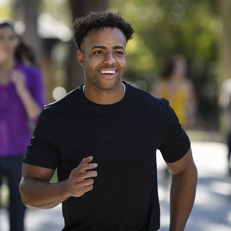 A young man running at an event